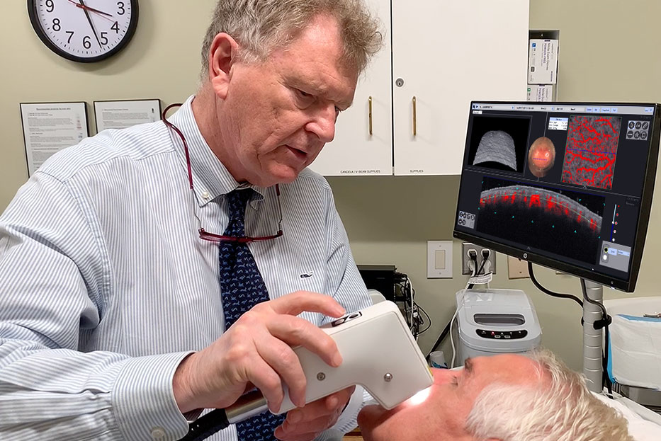 Professor Christopher Zachary, University of California, Irvine, scanning a patient with VivoSight OCT